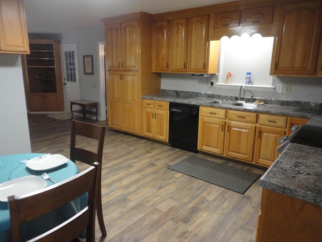 kitchen with range, hardwood / wood-style flooring, dishwasher, and sink