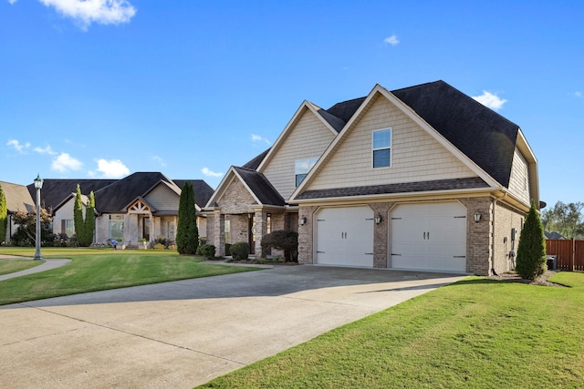 craftsman-style house with a front yard and a garage