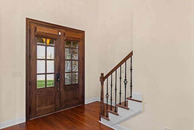 entryway featuring dark hardwood / wood-style flooring and french doors