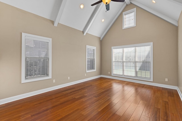 unfurnished room featuring lofted ceiling with beams, hardwood / wood-style flooring, and ceiling fan