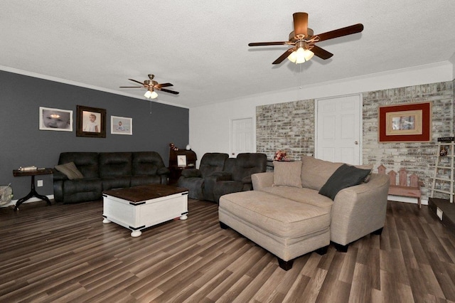 living area featuring dark wood-type flooring, crown molding, a textured ceiling, and ceiling fan