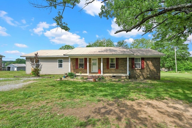 single story home featuring brick siding, a front lawn, and covered porch
