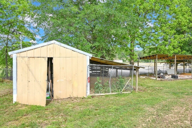 view of shed with fence