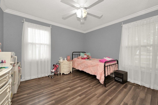 bedroom with crown molding, a ceiling fan, and dark wood-type flooring