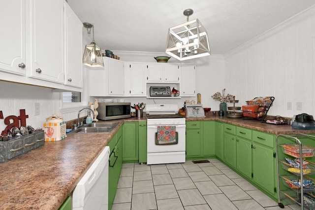 kitchen with crown molding, dark countertops, a sink, white appliances, and white cabinetry