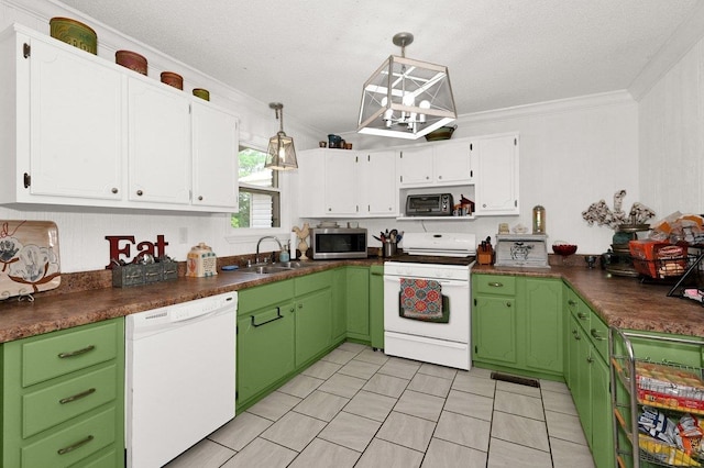 kitchen with ornamental molding, dark countertops, white appliances, white cabinets, and a sink