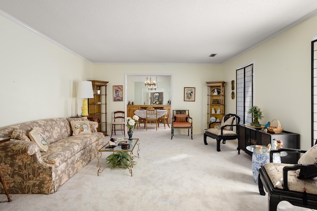 living room featuring light colored carpet, ornamental molding, and an inviting chandelier