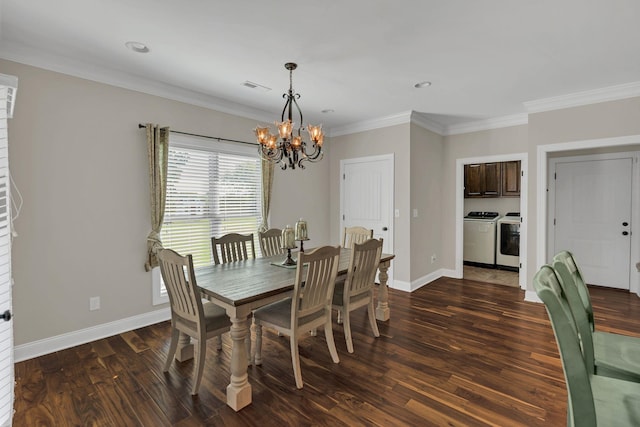 dining room featuring dark wood-style floors, crown molding, visible vents, and washer and dryer