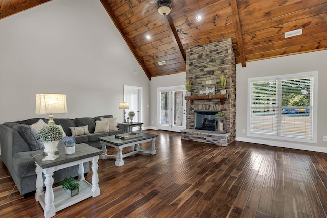 living room featuring baseboards, wood ceiling, wood finished floors, a stone fireplace, and high vaulted ceiling