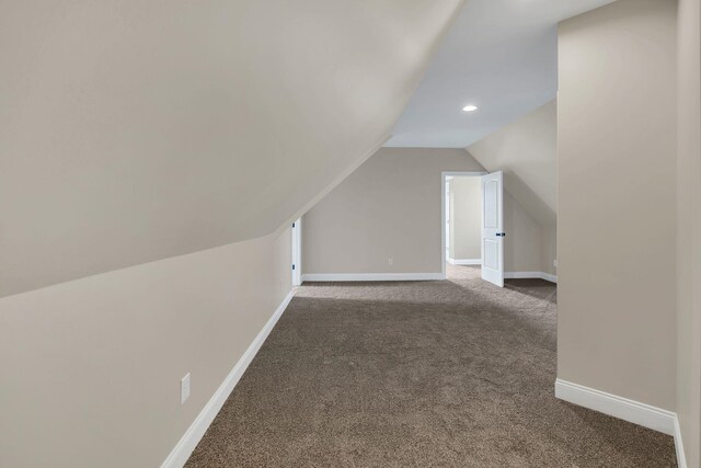 bonus room featuring lofted ceiling, recessed lighting, carpet, and baseboards