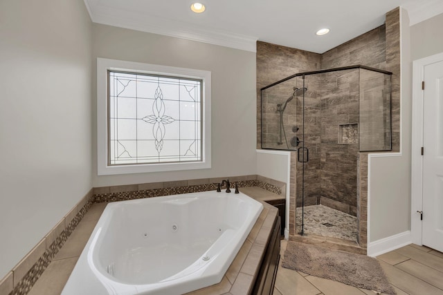 bathroom featuring a jetted tub, recessed lighting, a shower stall, and crown molding