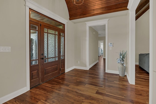 foyer entrance featuring lofted ceiling, wood ceiling, baseboards, and dark wood-style flooring