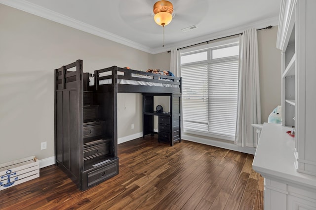 bedroom featuring baseboards, visible vents, ceiling fan, ornamental molding, and dark wood-style flooring