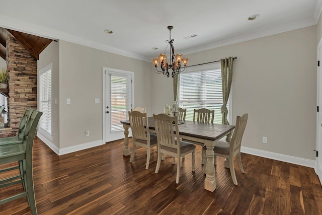 dining space featuring plenty of natural light, visible vents, wood finished floors, and ornamental molding