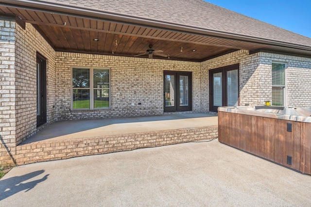 view of patio / terrace featuring french doors, ceiling fan, and an outdoor kitchen