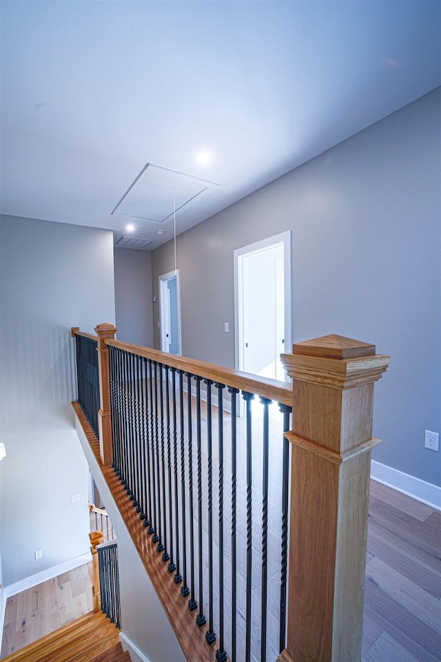 stairs with hardwood / wood-style floors