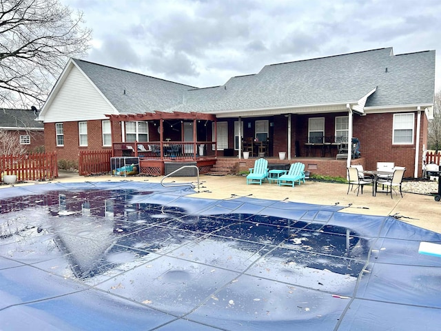 view of pool featuring a covered pool and a patio