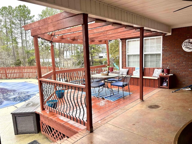 deck with fence and a pergola