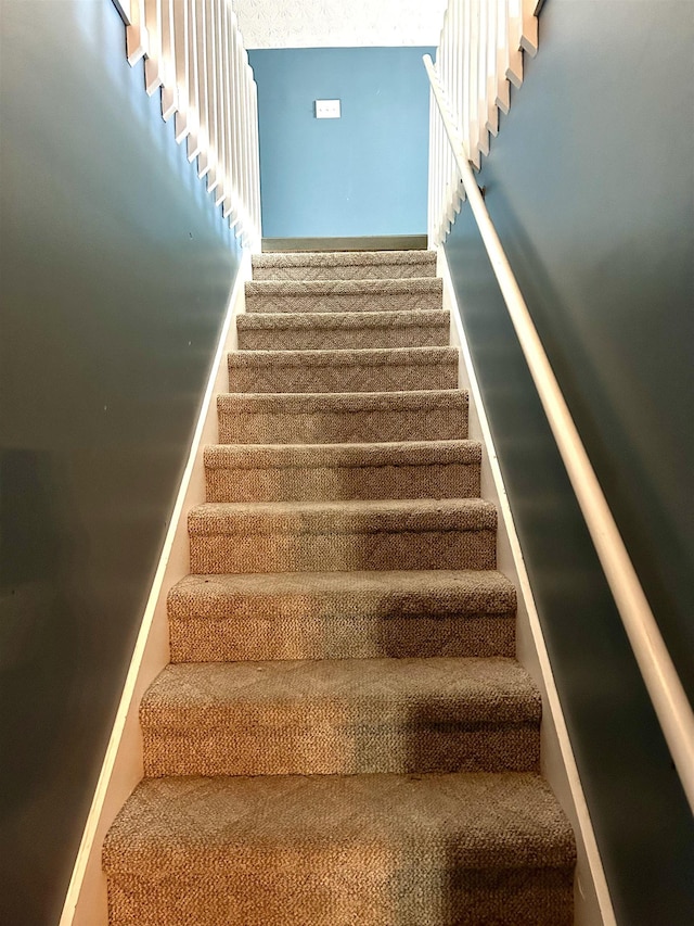 staircase with baseboards