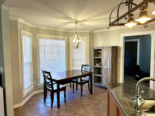 dining space featuring plenty of natural light, crown molding, a chandelier, and a textured ceiling