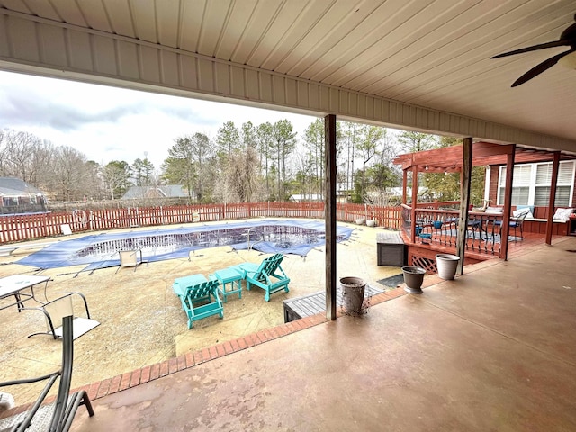 view of patio with a fenced backyard, a ceiling fan, and a fenced in pool