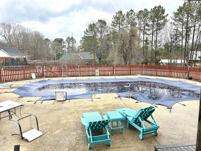 view of pool with fence and a fenced in pool