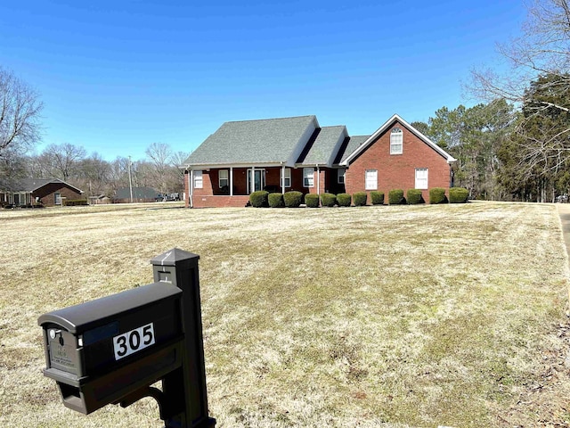 view of front of home featuring brick siding