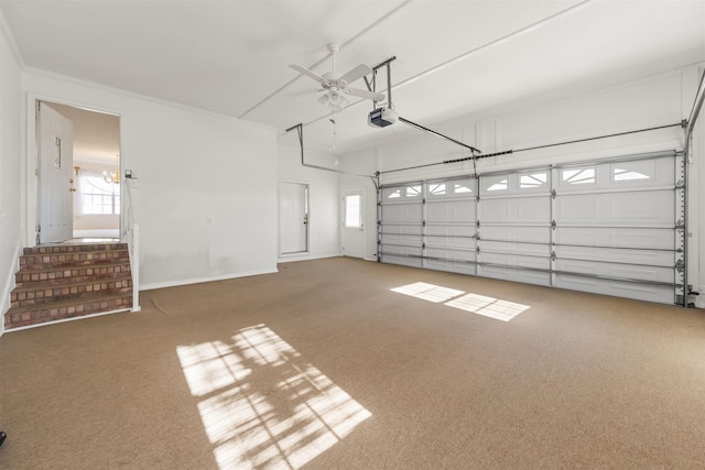 garage with ceiling fan and a garage door opener