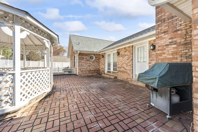 view of patio featuring a grill