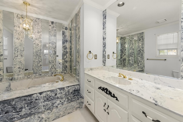 bathroom featuring crown molding, vanity, and a chandelier