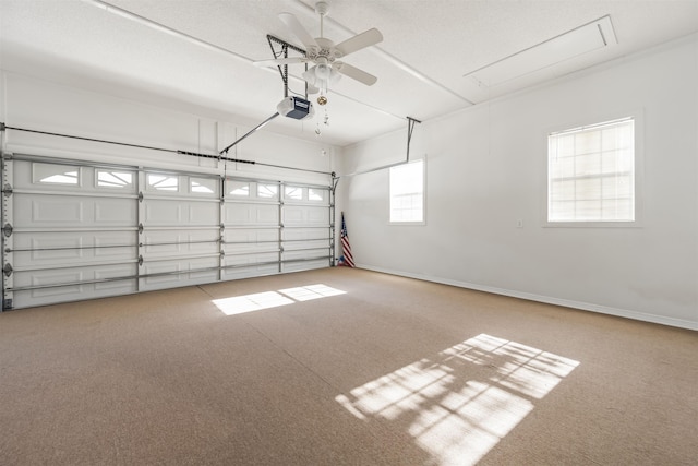 garage with a garage door opener and ceiling fan