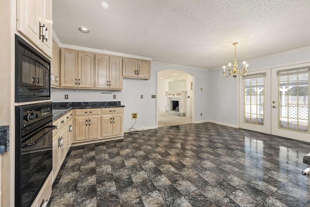 kitchen with light brown cabinetry, french doors, a textured ceiling, black appliances, and decorative light fixtures