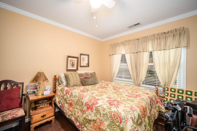 bedroom featuring dark hardwood / wood-style flooring, a textured ceiling, ceiling fan, and ornamental molding