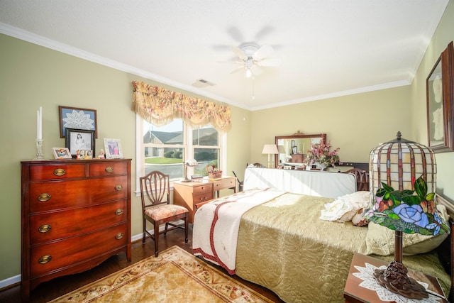 bedroom featuring ceiling fan, dark hardwood / wood-style flooring, and crown molding