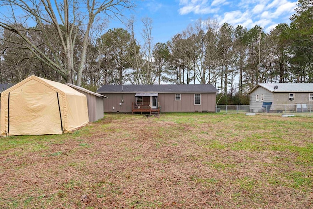 rear view of house with a lawn