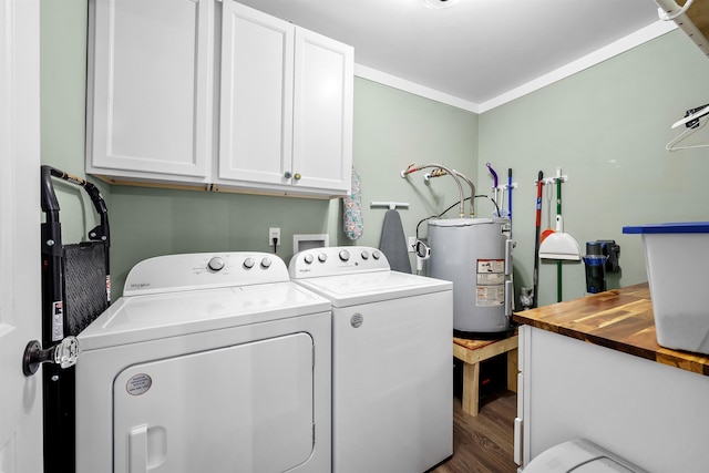 clothes washing area with cabinets, dark hardwood / wood-style flooring, ornamental molding, water heater, and separate washer and dryer