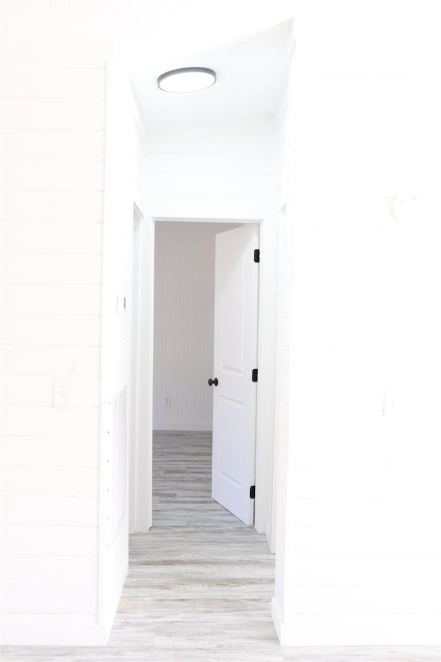  - corridor with light wood-style flooring