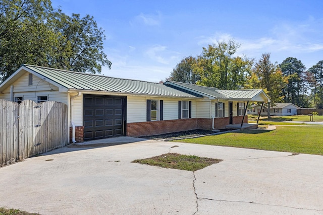 ranch-style house featuring a porch, a garage, and a front yard