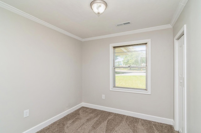 carpeted spare room with crown molding