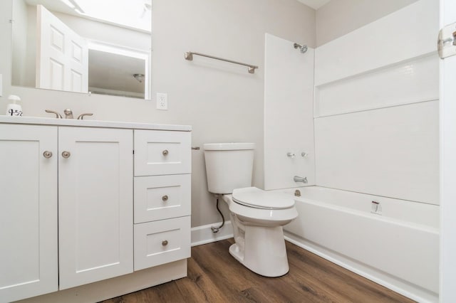 full bathroom featuring bathtub / shower combination, hardwood / wood-style floors, vanity, and toilet