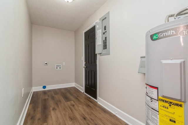 interior space featuring hookup for a washing machine, dark hardwood / wood-style floors, a textured ceiling, water heater, and hookup for an electric dryer