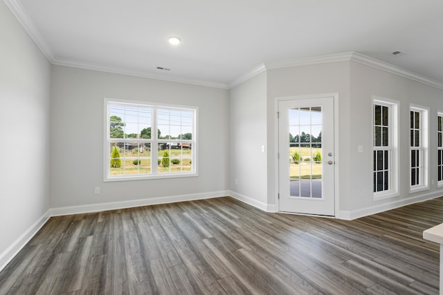 spare room with wood-type flooring and ornamental molding