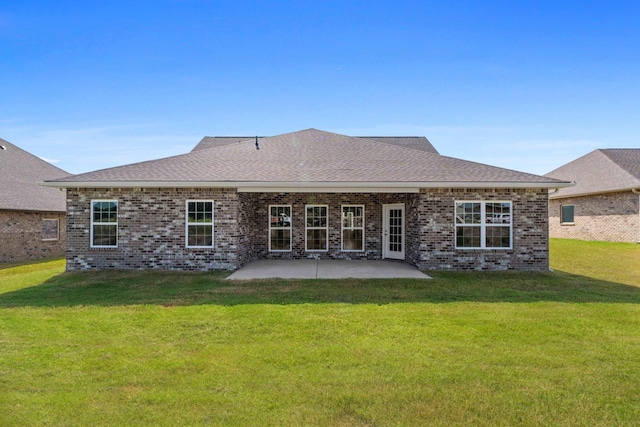 rear view of house with a patio area and a yard