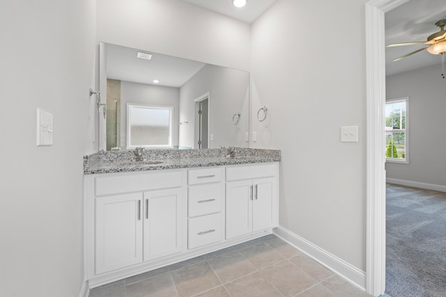 bathroom with ceiling fan and vanity