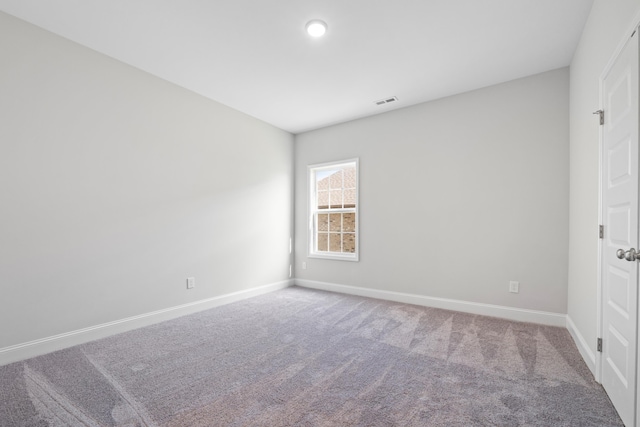 empty room featuring carpet flooring