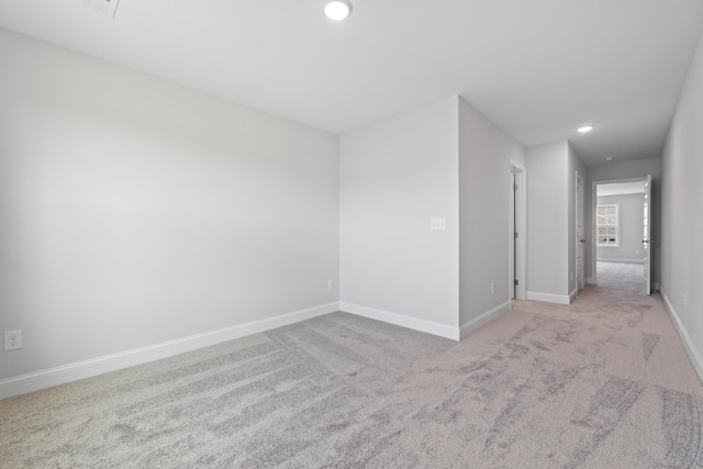 empty room featuring light colored carpet