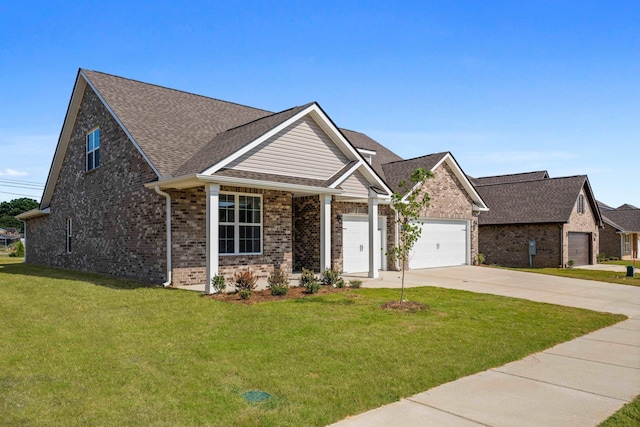 craftsman inspired home with a garage and a front yard