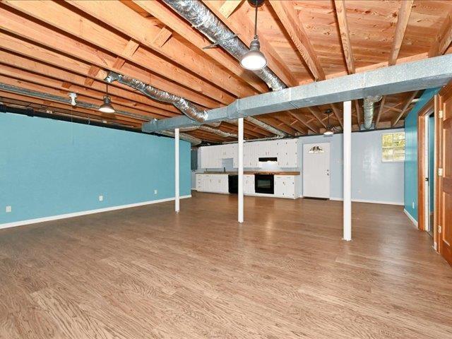 basement with wood-type flooring