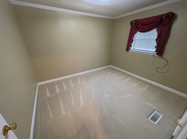 unfurnished room featuring light colored carpet, baseboards, ornamental molding, and visible vents