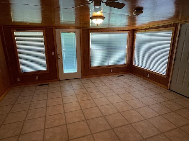 unfurnished sunroom featuring visible vents